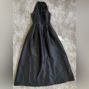 Black high neck dress with sheer beaded deep v-neck